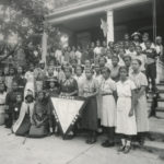 A group of African American women on the steps of a building