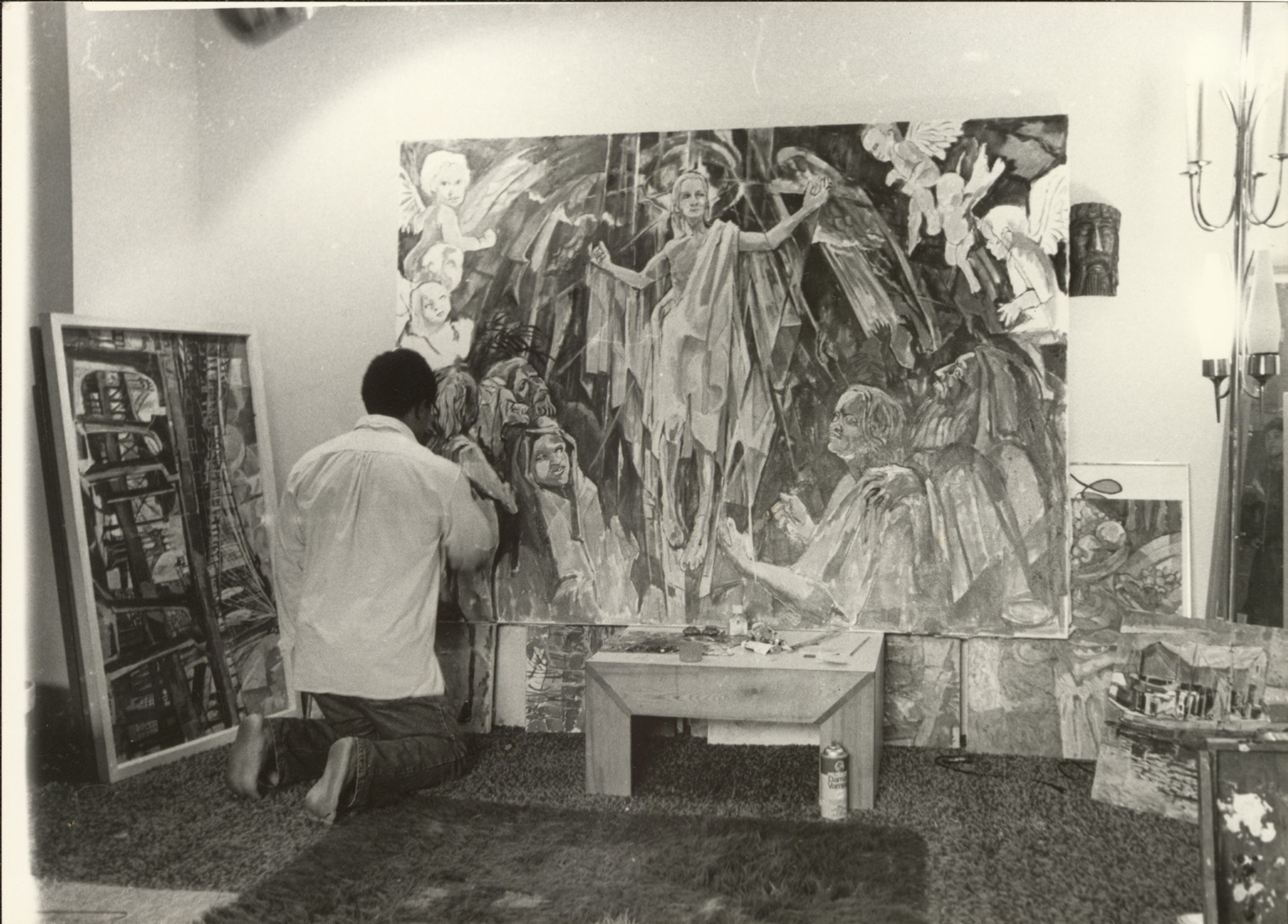 Loper working on painting, n.d.